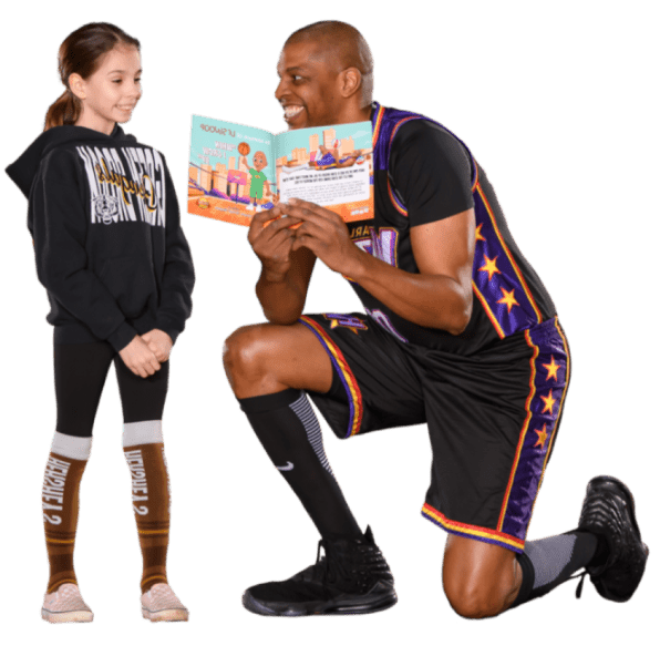 Swoop reading The Adventures of Lil’ Swoop with a student